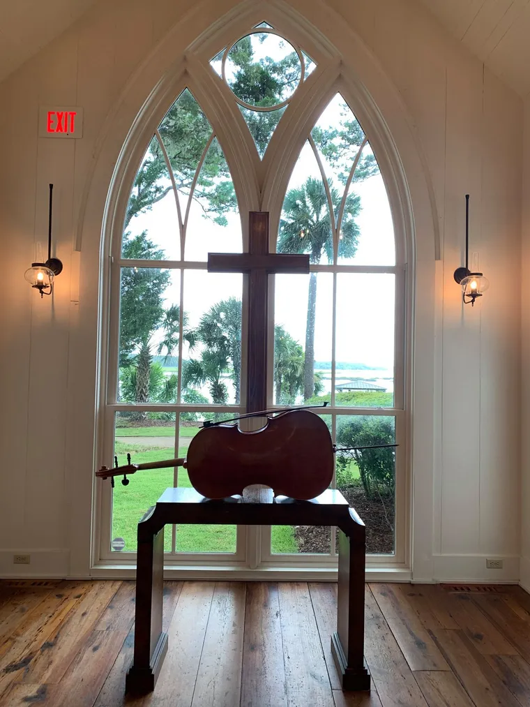 Cellist performing in a chapel