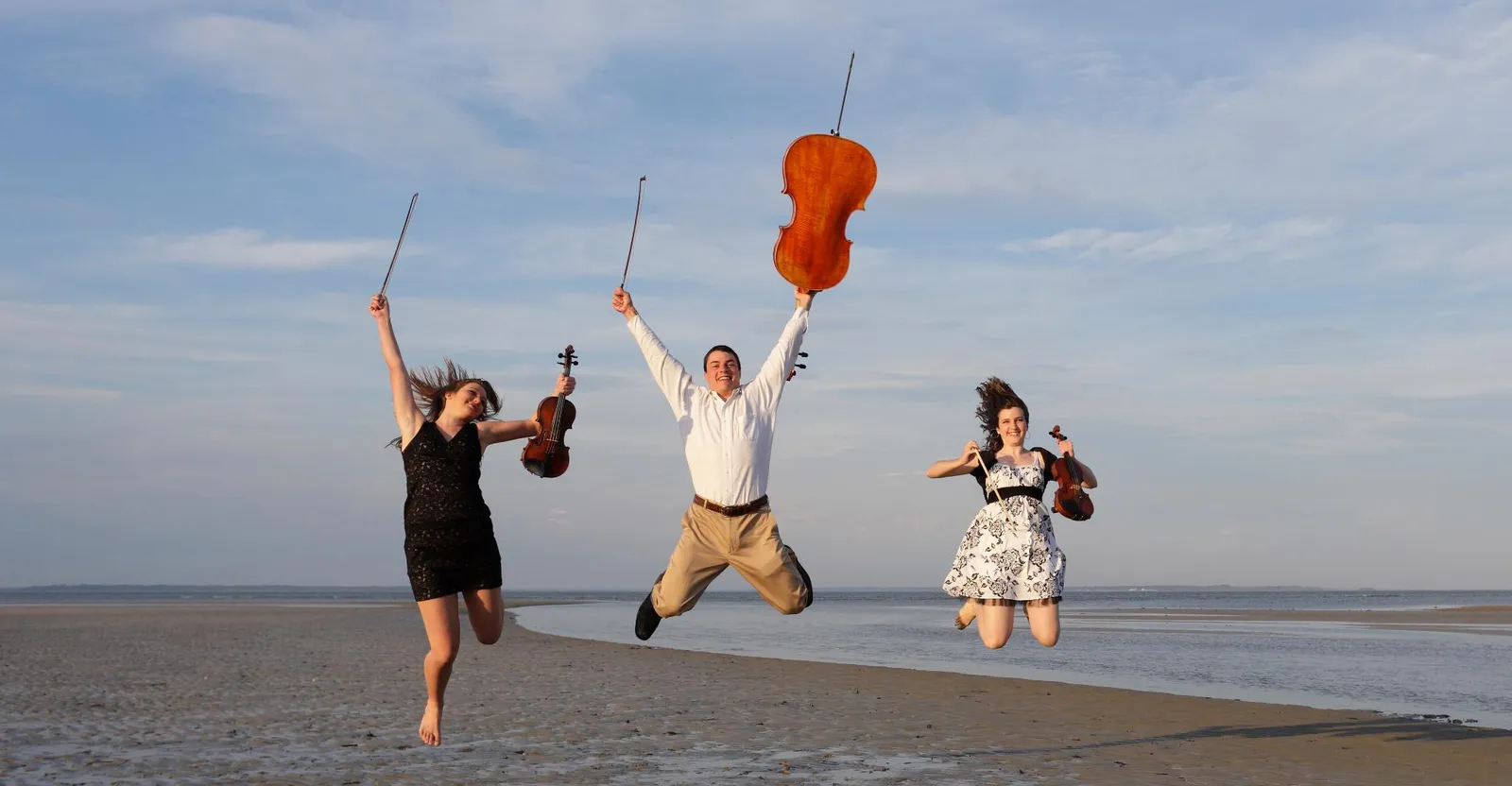 Coastal Chamber Musicians celebrating outdoors after a performance